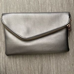 Metallic silver clutch with gold trim
